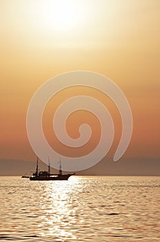 Ride on a pirate ship in the Thermaic gulf at the sunset photo