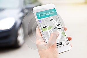 Ride share taxi service on smartphone screen. photo