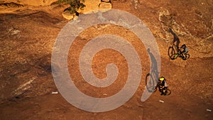 Ride to escape everything else. High angle shot of two young male athletes mountain biking in the wilderness.