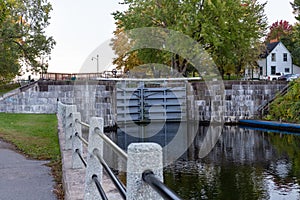 Rideau Canal, Hog\'s Back locks in Ottawa. Fall season in park with river