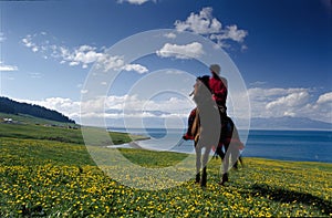 A rider besides the lake photo