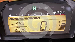Rider Checking RPM, Acceleration on Motorcycle Digital Speedometer. Close up