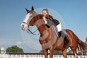 Rider elegant woman riding her horse outside