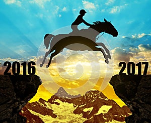 The rider on the horse jumping into the New Year 2017