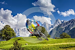 Rider with mountain bike downhill in Bregaglia Valley