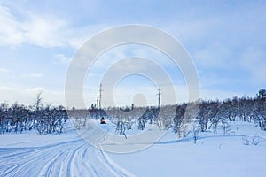 Rider on the Snowmobile in the mountains Ski resort in Amut Russia.