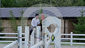 The rider training at the arena