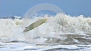 Riderless surfboard in air