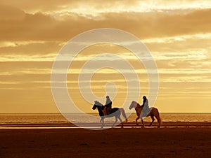 Riders on Horseback in Sunset