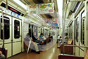 Riders on metro, Osaka, Japan