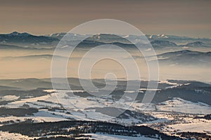 Ridges and valleys in mist in glowing morning light Slovakia