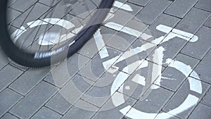 Riding bicycle, crossing cycle path sign, bike friendly city, urban scene