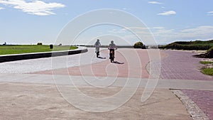 Riding Bicycles Beach Ocean Promenade