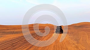 Riding buggies in the desert during sunset