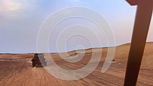 Riding buggies in the desert during sunset