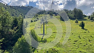 Riding the chair lift through beautiful mountain scenery in the summer