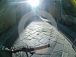 Riding cobblestone streets of Florence by bicycle