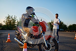 Riding between cones, lesson in motorcycle school