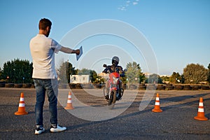 Riding between cones, lesson in motorcycle school