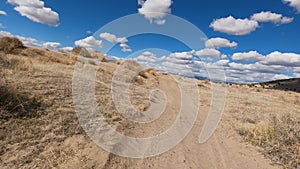 Riding desert riding narrow remote trail 4K POV