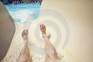 Riding down a slide at a waterpark resort