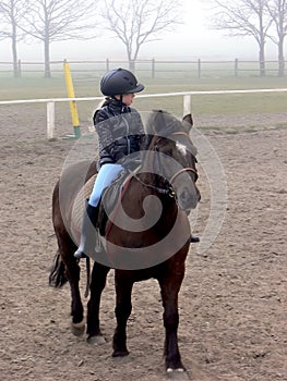 Riding girl in the fog