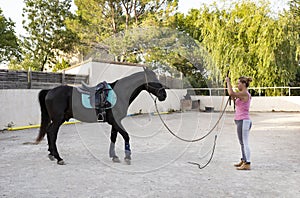 Riding girl and horse