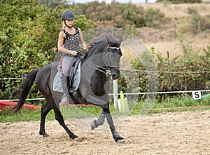 Riding girl and horse