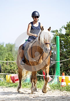 Riding girl and horse