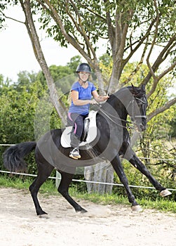 Riding girl and horse