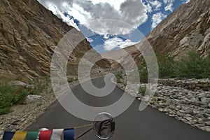 Riding through the Himalaya mountains in the state of Ladakh, India.