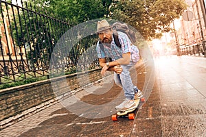 Riding on longboard in the streets urban, setting of lifestyle concept