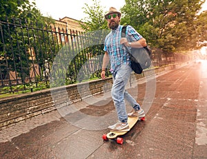 Riding on longboard in the streets urban, setting of lifestyle concept