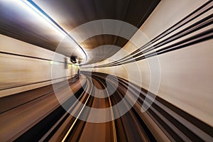 Riding the metro with motion blurred tube lines in tunnel