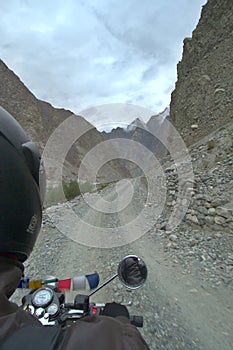 Riding on a motorcycle in the state of ladakh through the rocky terrain, India.