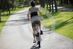 riding mountain bike in tropical park