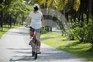 Riding mountain bike in tropical park