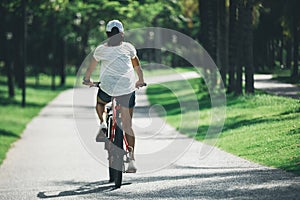 Riding mountain bike in tropical park