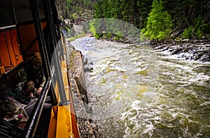 Riding the narrow gage train between Durango and Silverton Colorado right beside rushing river
