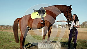 Riding school. A female rider performs exercises with a horse 4K