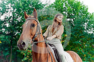 Riding a steed. Woman with horse in countryside. Equestrianism fosters well-being, relaxation. Engage in horse therapy, enjoy