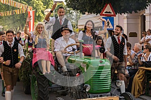 Riding the tractor at Villacher Kirchtag proession