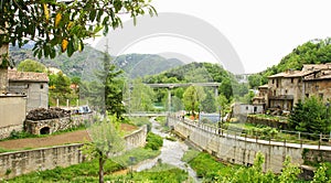 Riera with mountains in background in Cercs