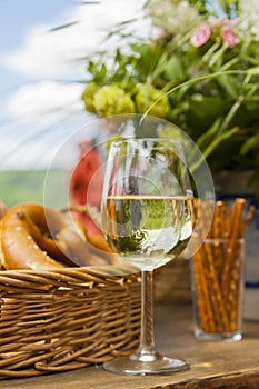 Riesling at wine festival, pretzels and flowers photo