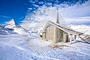 Riffelberg chapel under Matterhorn mountain peak scenic winter landscape view