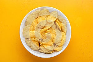 Riffled potato chips or crisps in bowl