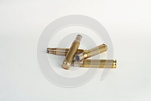 Rifle bullet shell casings on white background