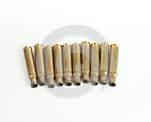 Rifle bullet shell casings on white background