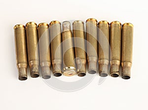 Rifle bullet shell casings on white background