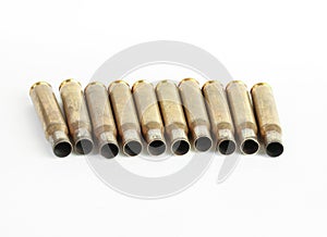 Rifle bullet shell casings on white background